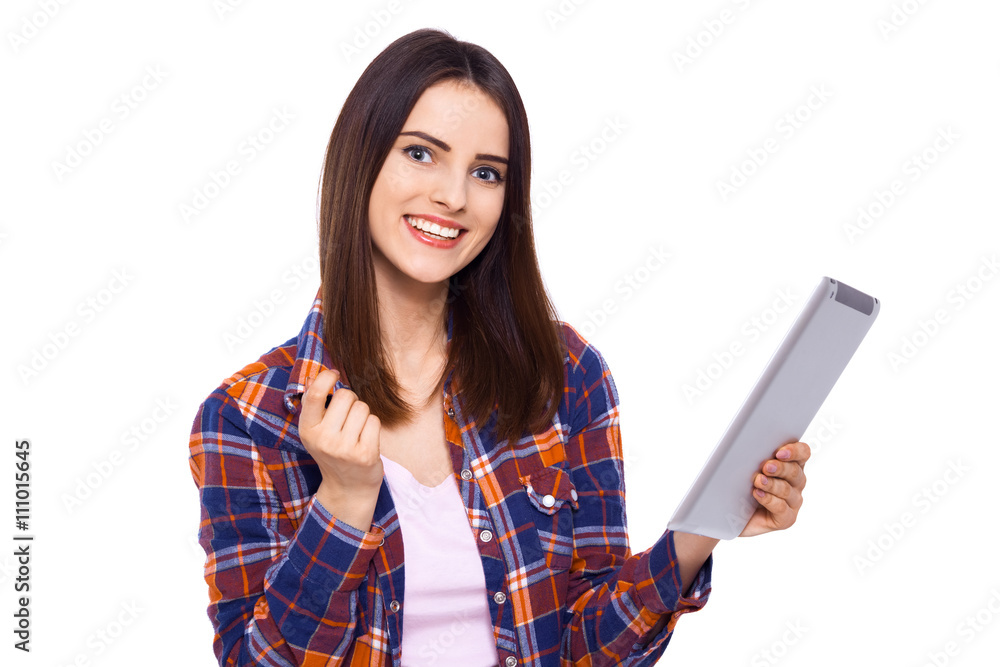 Technologies making life easier. Beautiful young woman holding digital tablet and looking at camera with smile while standing against white background Technologies making life easier. Beautiful young woman holding digital tablet and looking at camera with smile while standing against white background