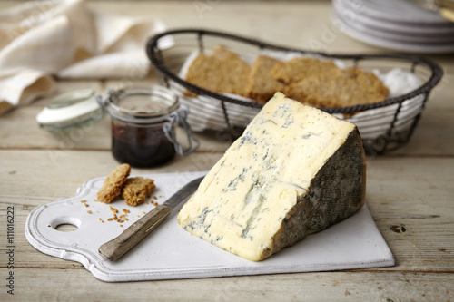 Block of stilton cheese, bread, jam