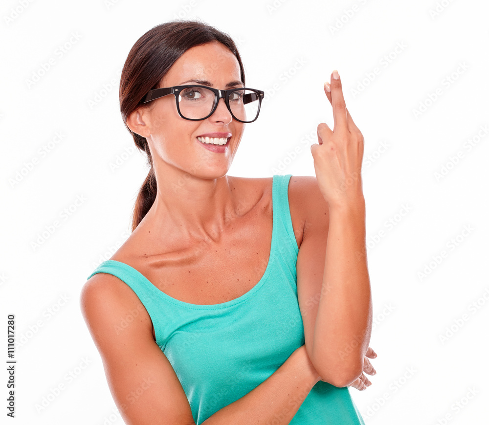 Wishing brunette woman with fingers crossed Wishing brunette woman with fingers crossed