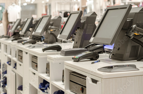 Electronic cash or cashier standing at the counter