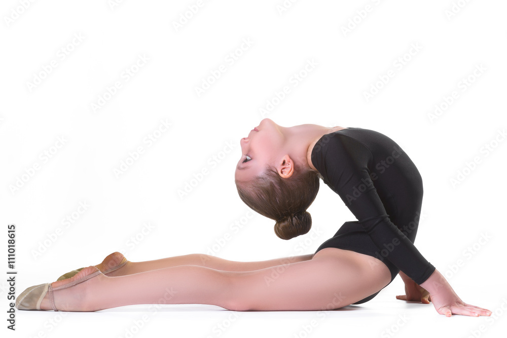 Girl doing gymnastic exercises or exercising on white background Girl doing gymnastic exercises or exercising on white background