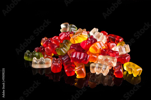 gummy bears on a black background