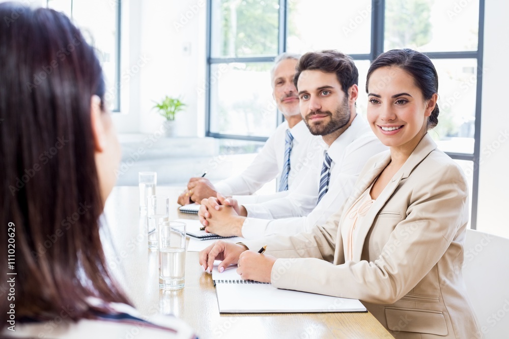 Business colleagues discussing in a meeting Business colleagues discussing in a meeting