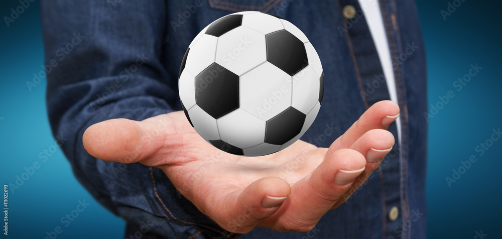 Businessman holding football in his hand