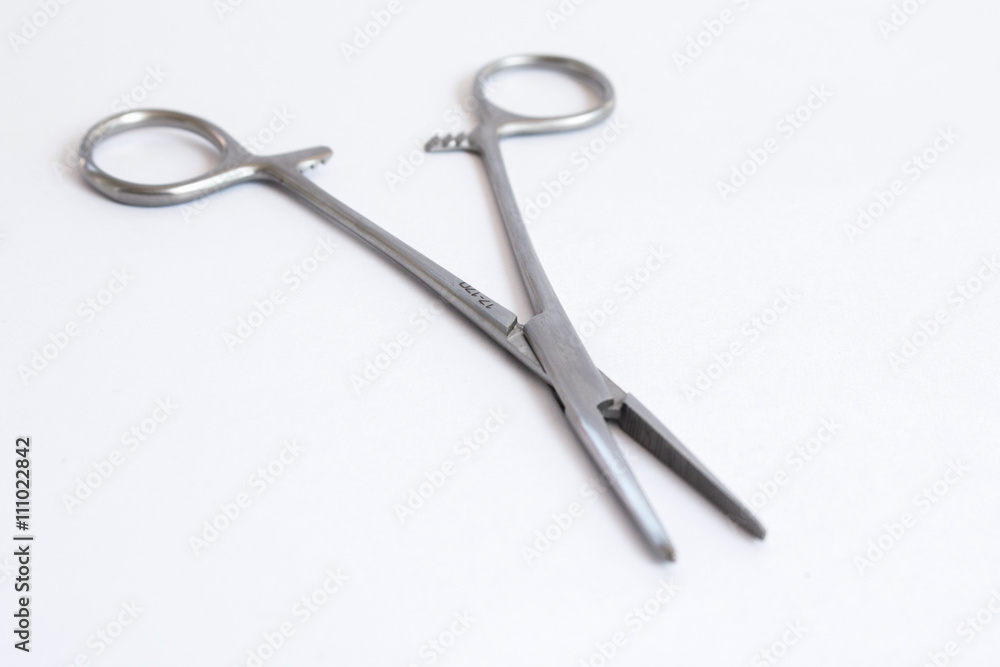 surgical instruments and tools including , forceps and tweezers White background surgical instruments and tools including , forceps and tweezers White background