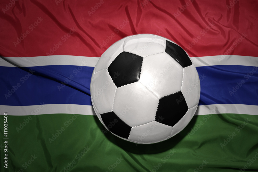black and white football ball on the national flag of gambia black and white football ball on the national flag of gambia