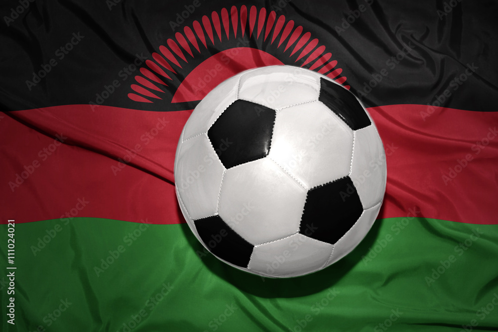 black and white football ball on the national flag of malawi black and white football ball on the national flag of malawi