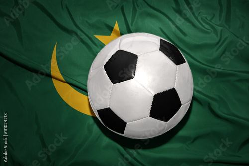 black and white football ball on the national flag of mauritania