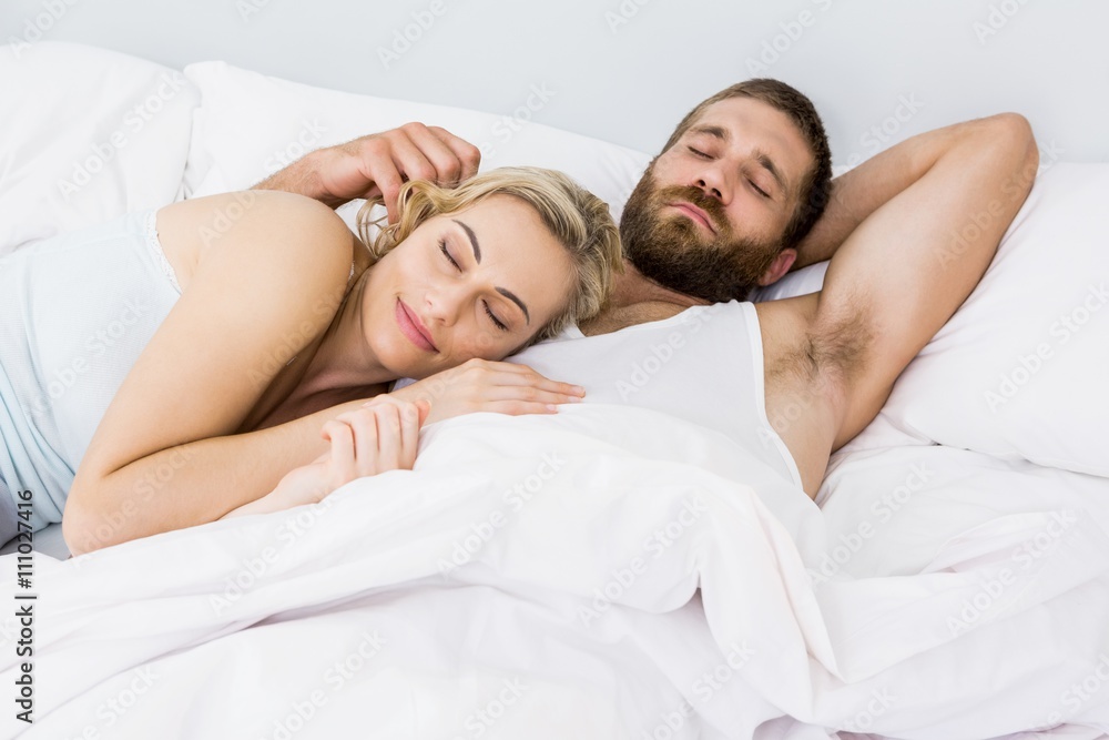 Couple sleeping on bed Couple sleeping on bed