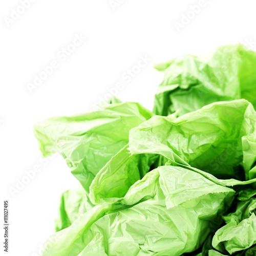 Green plastic garbage bags on a white background