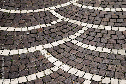 black and white porphyry paving of a traditional Italian town city center