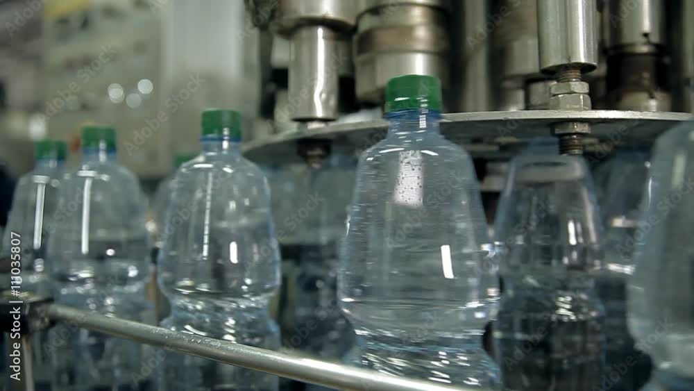 A line for bottling mineral water into bottles A line for bottling mineral water into bottles