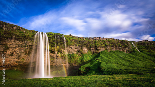 Seljalandsfoss - Iceland. Another of the famous waterfalls of Iceland. This waterfall of the river Seljalands  drops 60 metres  200 ft  over the cliffs of the former coastline