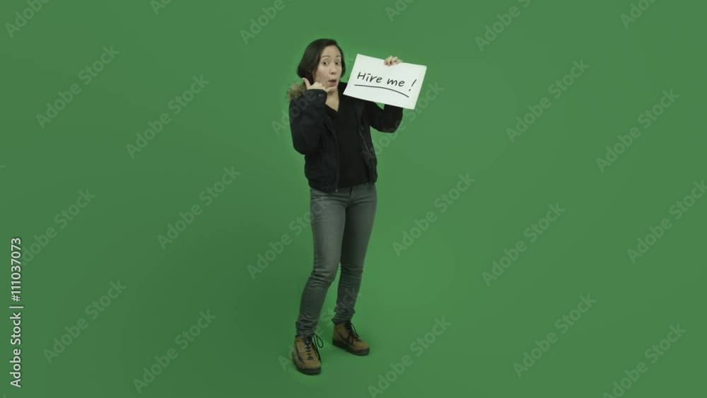 caucasian girl with winter jacket isolated on green screen unemployed with hire me sign caucasian girl with winter jacket isolated on green screen unemployed with hire me sign