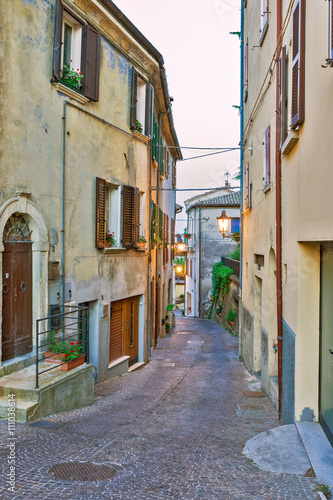 Fototapeta Naklejka Na Ścianę i Meble -  Evening small street Tuscany, Italy