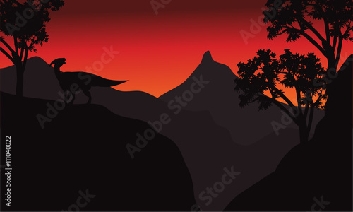 At sunset silhouette parasaurolophus in cliff