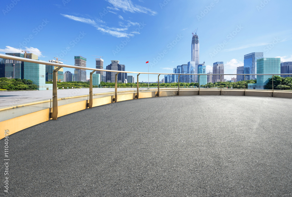 empty asphalt road with cityscape and skyline of hangzhou
