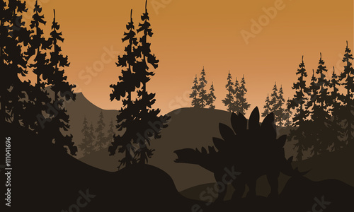 Silhouette of stegosaurus and spruce