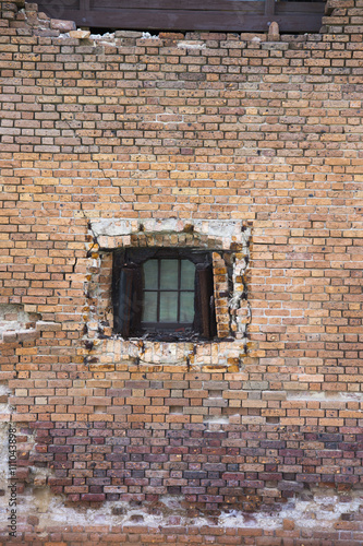 brick wall with small window