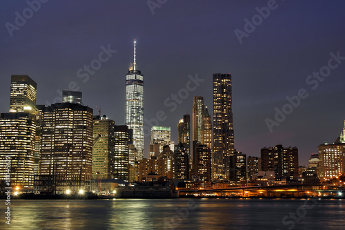 Downtown Manhattan at night with the new World Trade Center and East River