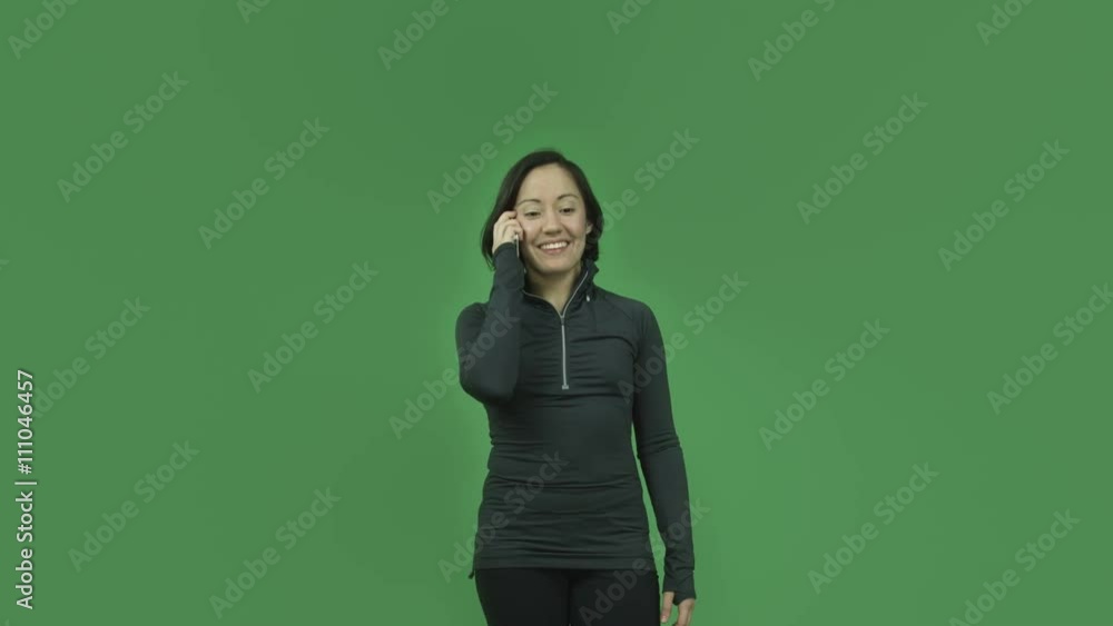 caucasian sporty girl isolated on green screen talking cell phone caucasian sporty girl isolated on green screen talking cell phone