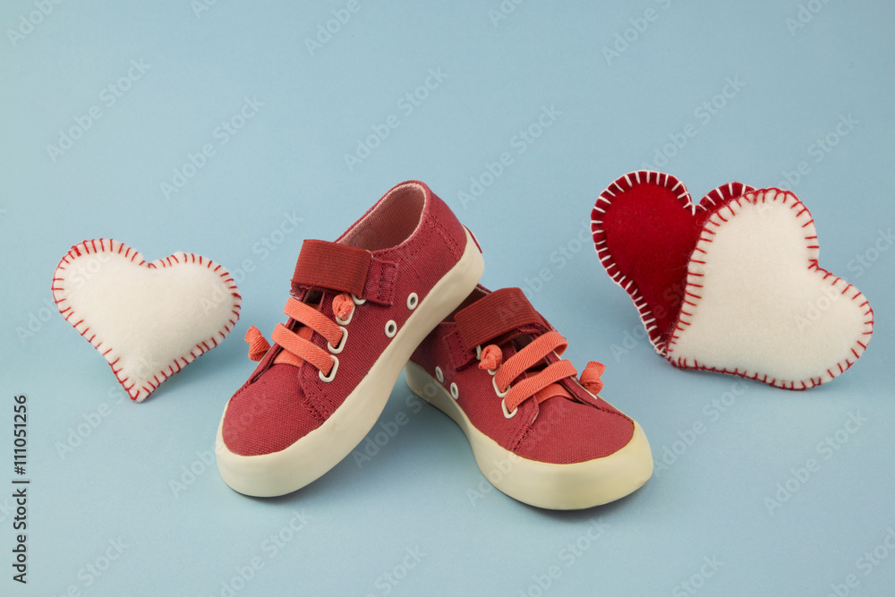 red shoes for little girl / portrait of little girl shoes with hearts