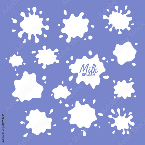Milk, yogurt or cream blots set. White smudges splashes drops on blue background. 