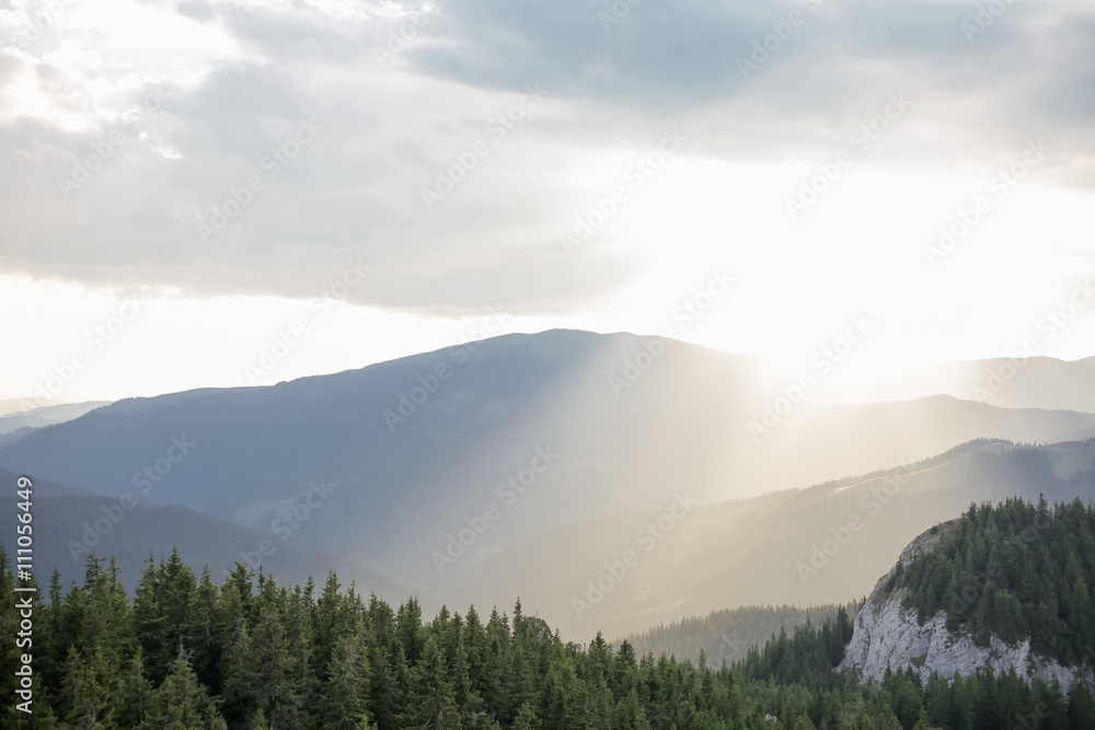 Sun shines over mountains