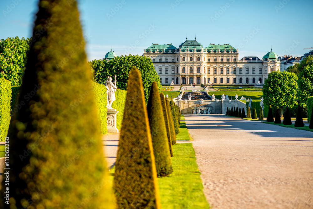 View on Upper Belvedere palace with park alley in Belvedere historic building complex in Vienna. - obrazy, fototapety, plakaty 