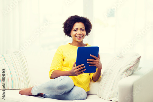 happy african american woman with tablet pc