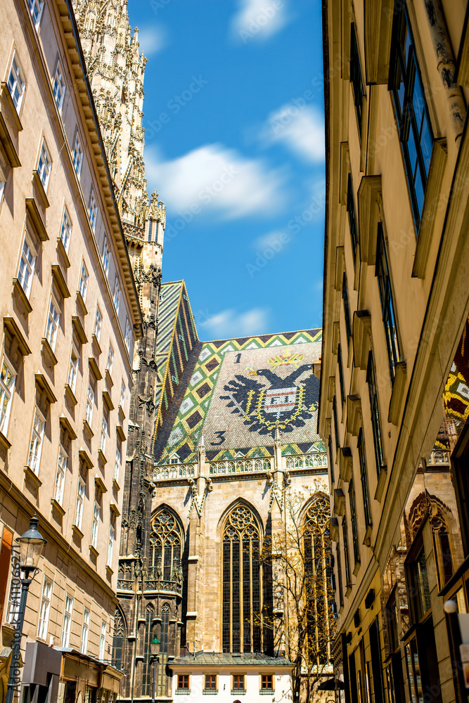 Fragment of Saint Stephen's cathedral with national emblem on the roof in the center of Vienna in Austria