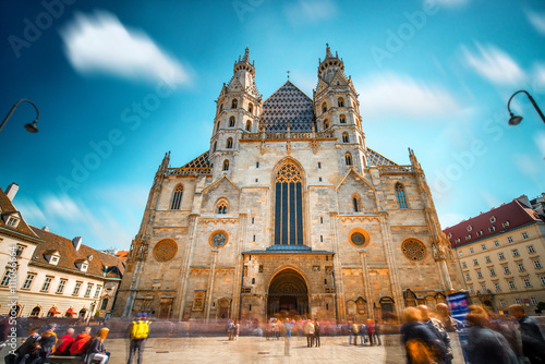Saint Stephen's Cathedral on the central square in Vienna. Long exposure image technic with blurred people and clouds