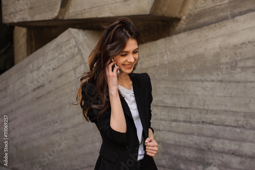 Young business woman talking on mobile phone