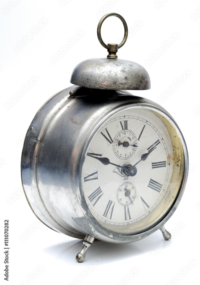 Old alarm clock isolated on white background
