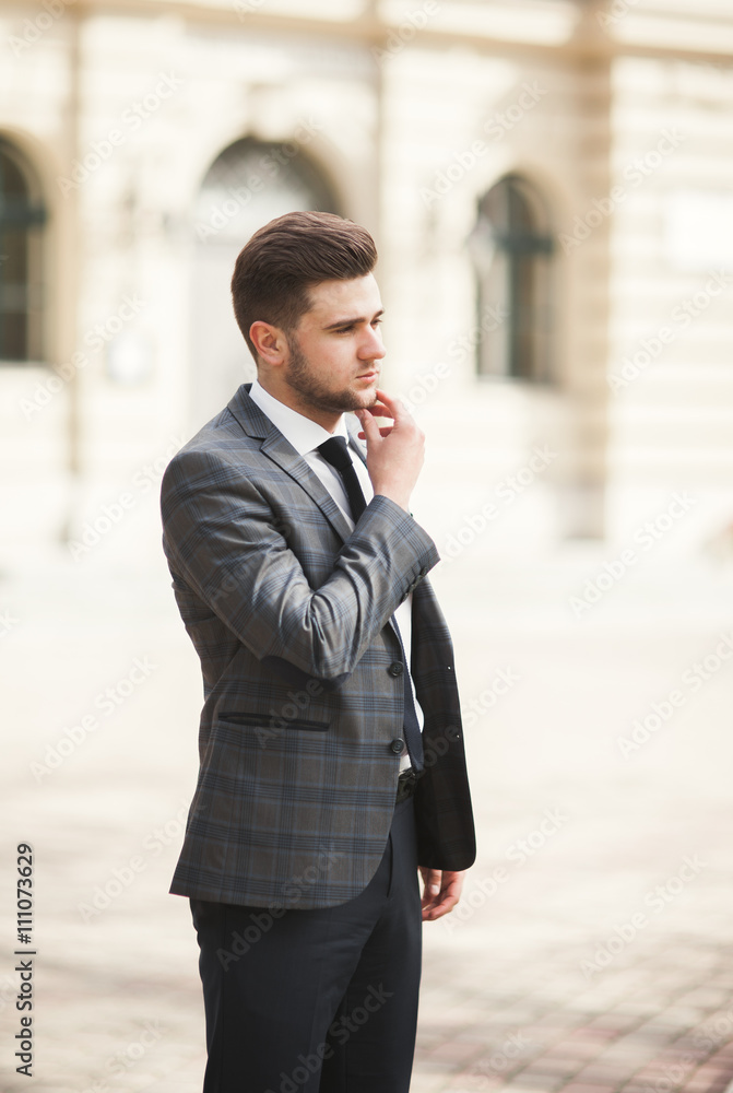 Handsome stylish young businessman posing portrait outdoor Handsome stylish young businessman posing portrait outdoor
