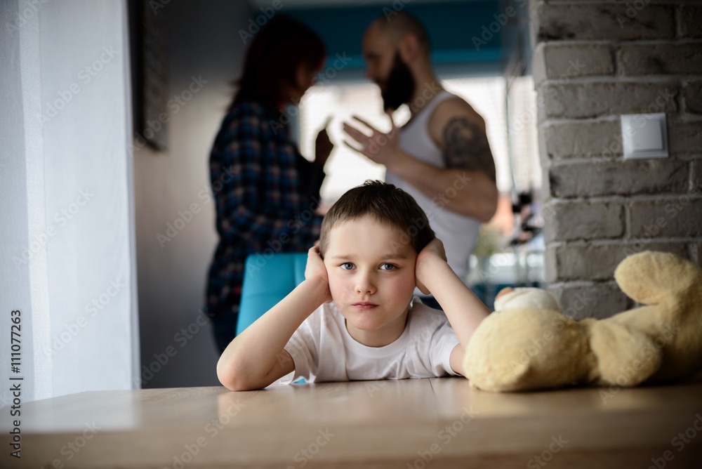 Sad, desperate little boy during parents quarrel Sad, desperate little boy during parents quarrel