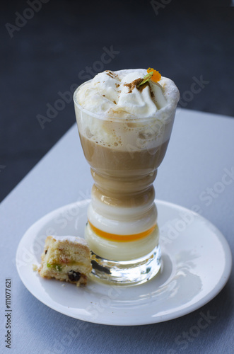 Barraquito – Traditional coffee in Tenerife ( Canary Islands), consisting of hot coffee, milk, milk condensed and liquor  with lemon and cinnamon photo