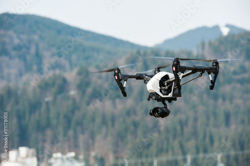 Drone in sky/Drone hovering in sky over mountains