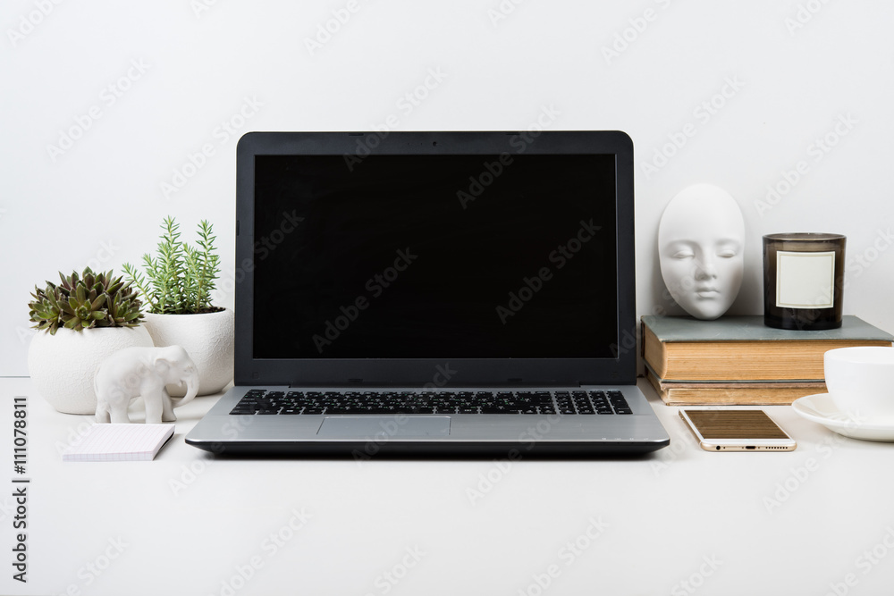 modern work space with laptop mockup on a table modern work space with laptop mockup on a table
