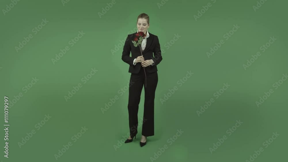 attractive caucasian business girl isolated on green romance with rose attractive caucasian business girl isolated on green romance with rose