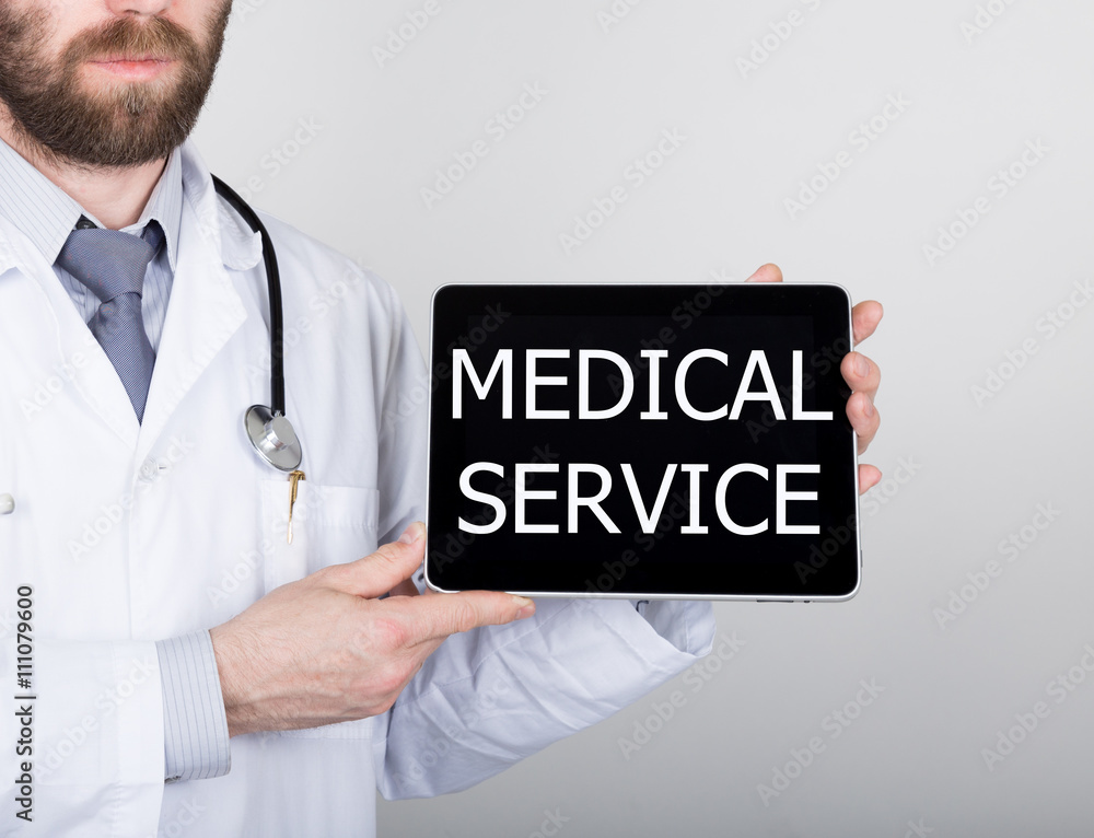 technology, internet and networking in medicine concept - Doctor holding a tablet pc with medical service sign. Internet technologies in medicine technology, internet and networking in medicine concept - Doctor holding a tablet pc with medical service sign. Internet technologies in medicine