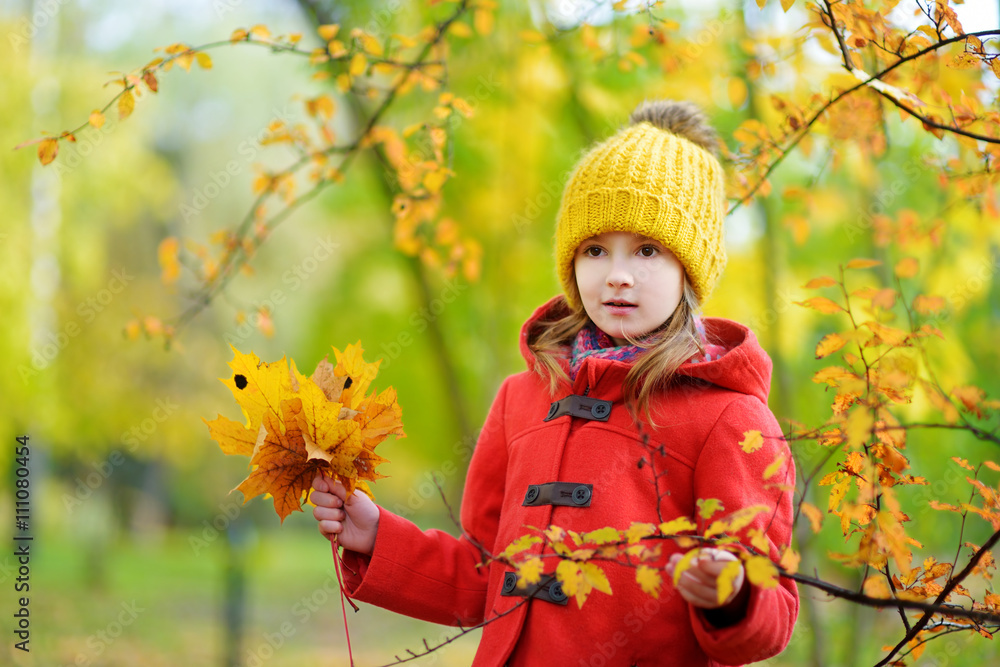 Cute little girl having fun on beautiful autumn day Cute little girl having fun on beautiful autumn day