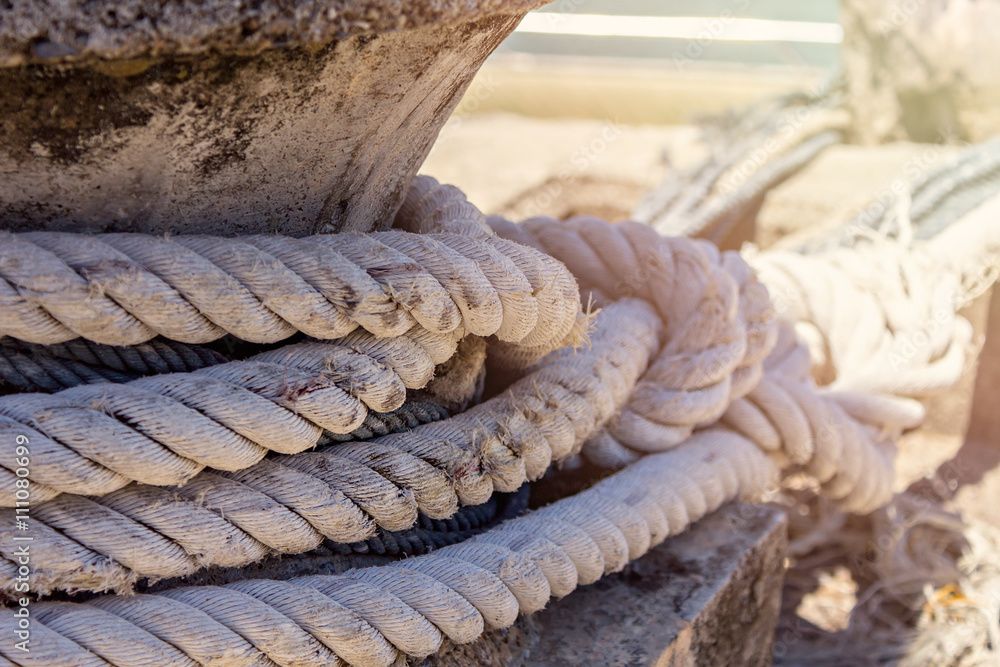 Fototapeta premium Old thick naval Rope on a Pier