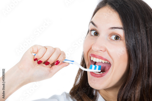young woman with toothbrush isolated on white