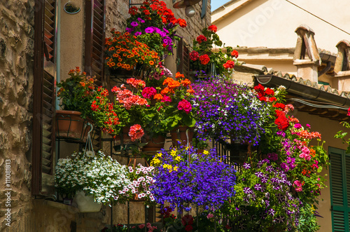 Romantic flowery balcony in Spello village, Umbria - Italy.