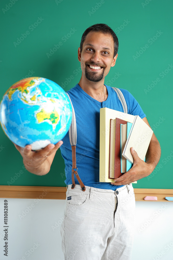 Geography teacher showing globe. Photo adult man with books and globe
