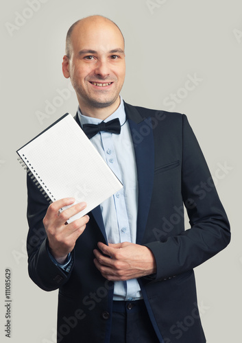 stylish man in suit shows a blank sheet