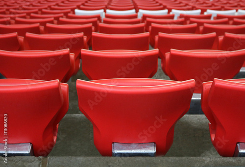 red plastic chairs at the stadium