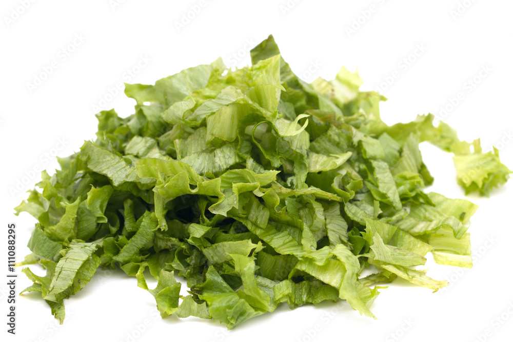 chopped lettuce leaves on a white background chopped lettuce leaves on a white background