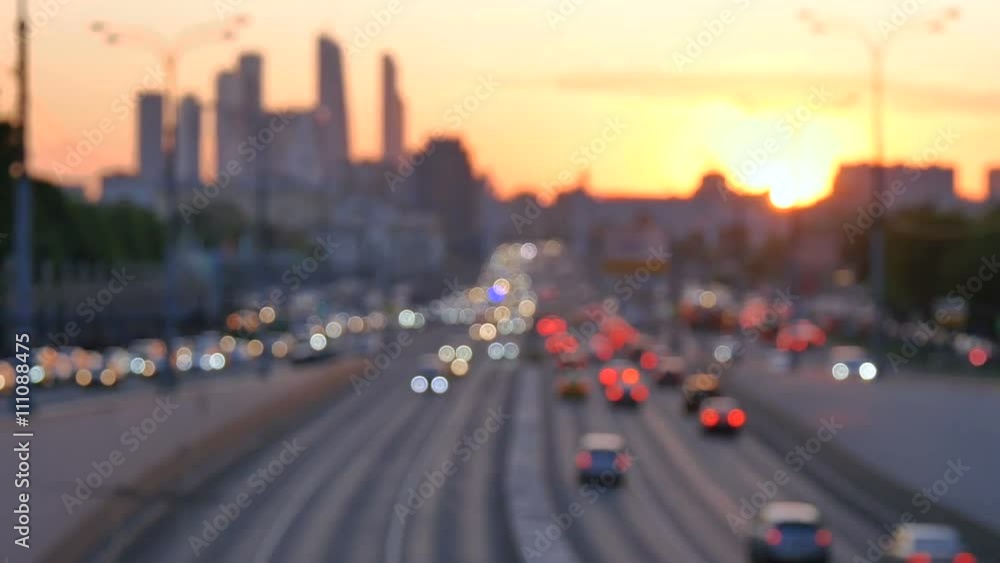 Car traffic at sunset. Bokeh background of the big city Car traffic at sunset. Bokeh background of the big city